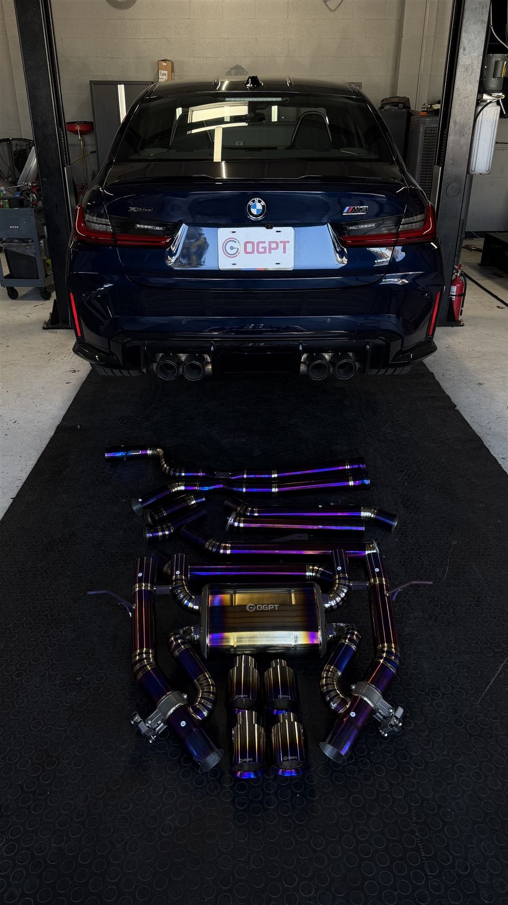 BMW M3 at OG Performance and Tuning with exhaust system laid out